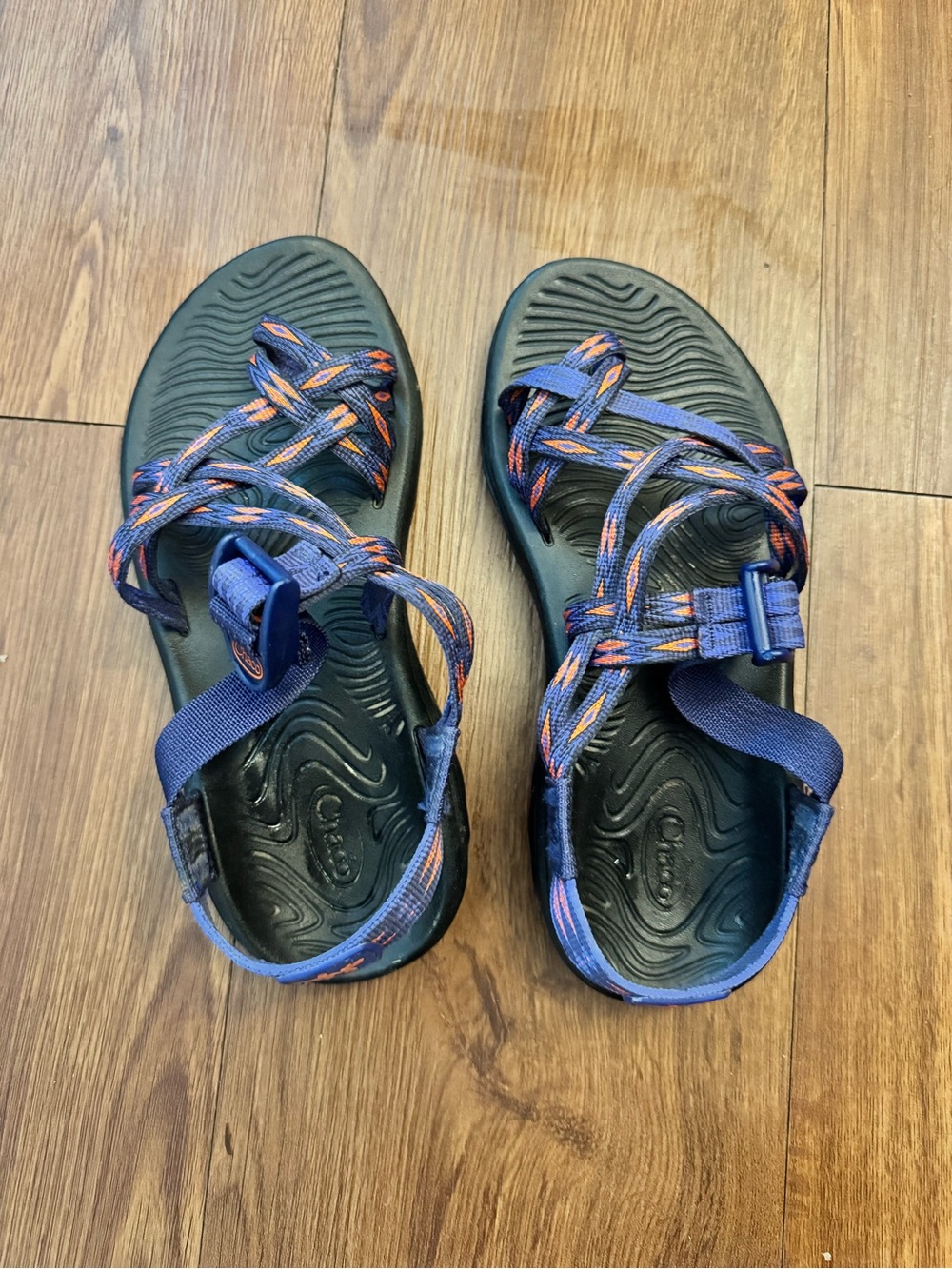 Chaco navy sport sandals with orange patterned straps